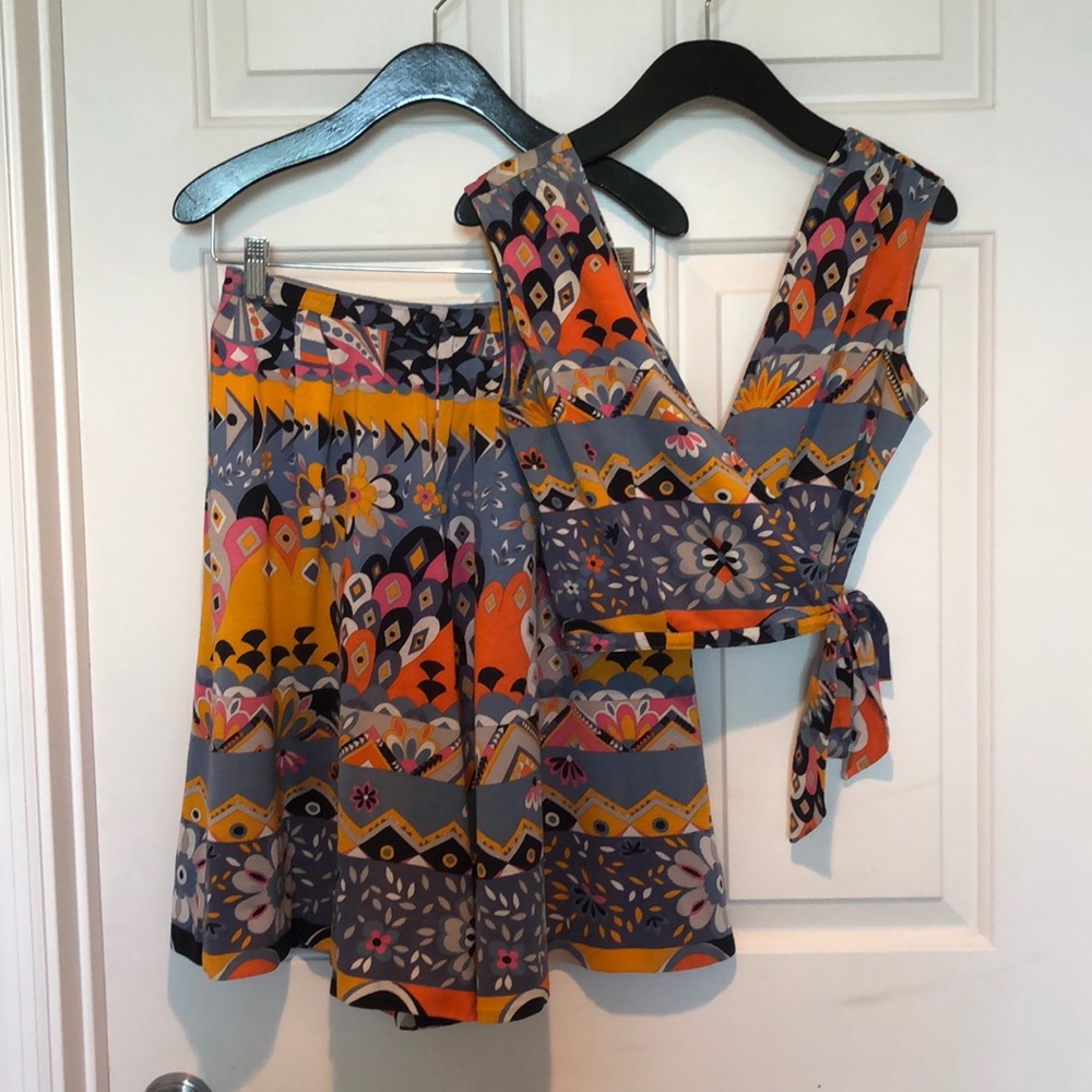 Colorful print pant skirt with cross cross top.